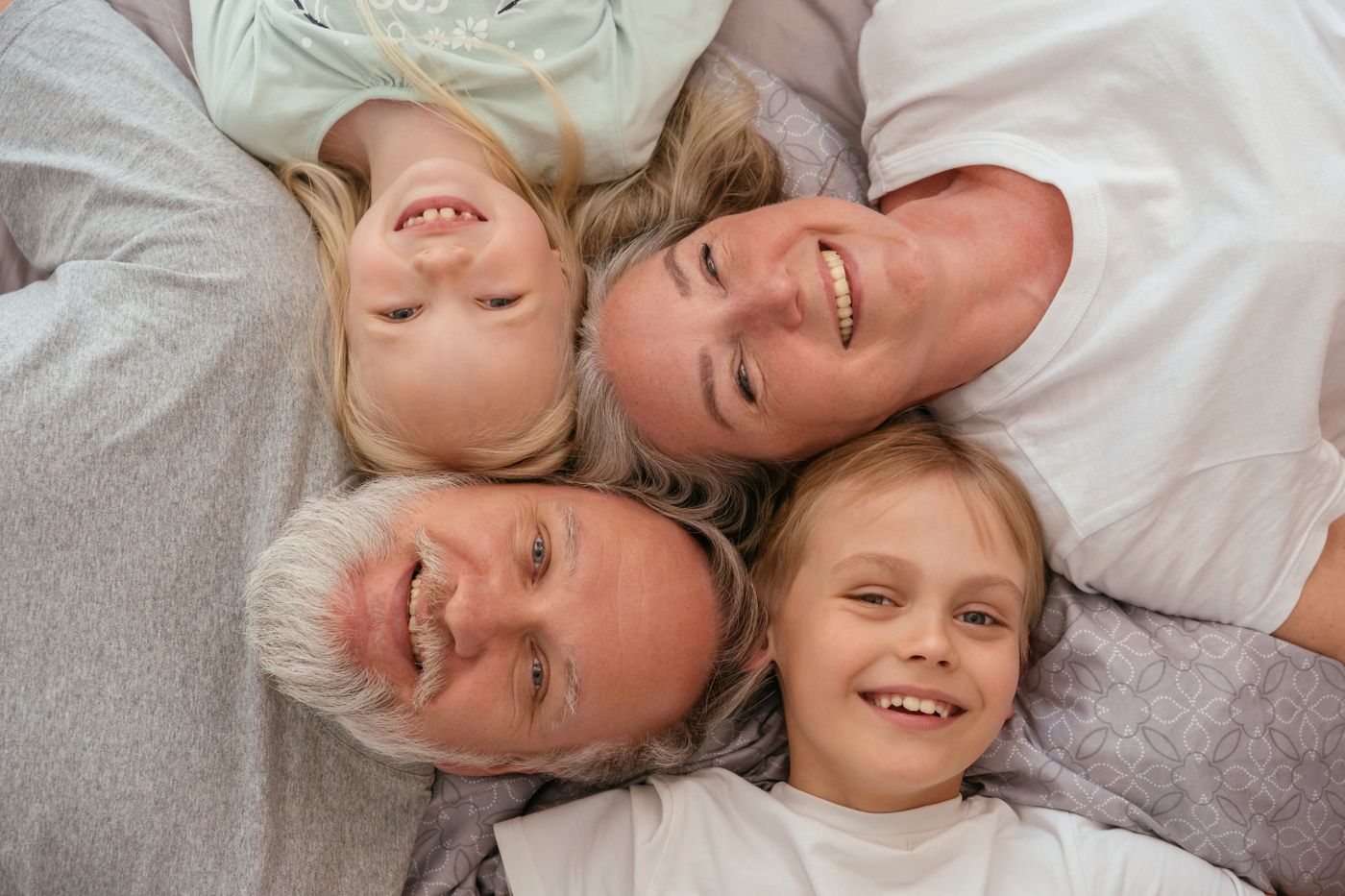 Grandparents laughing with their grandchildren